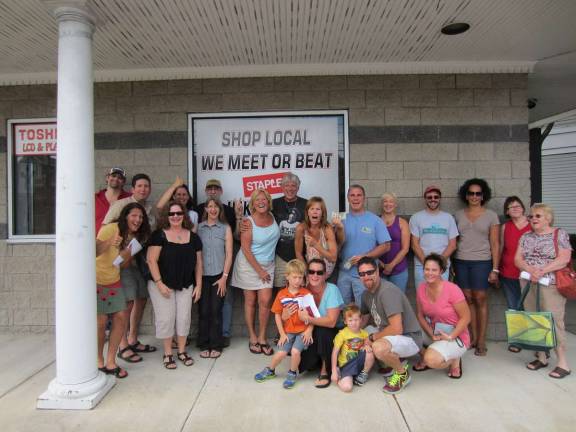 Some members of the Cash Mob posed outside of their target store: Computer Discounts of NJ.
