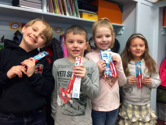 Leigh Ann Misiano's kindergarten class collected necessary health care items for others. Seen here are Ben, Michael, Ava, and Skylar