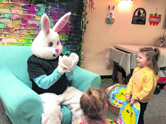 Sienna Miller, 4, smiles at the Easter Bunny at American Legion Post 289 in West Milford. The post hosted its annual Breakfast with the Easter Bunny and Easter egg hunt Sunday, March 24. (Photos by Kathy Shwiff)
