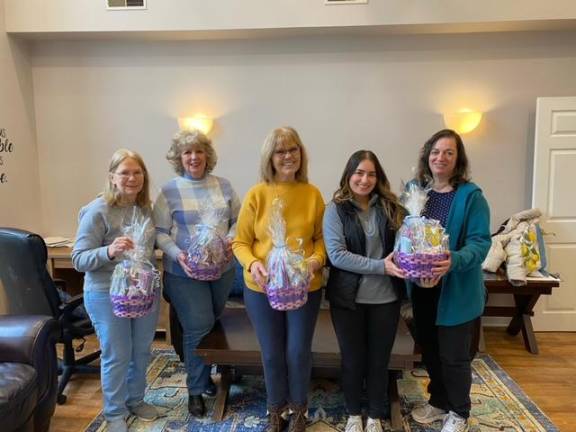 Members of the West Milford Woman’s Club recently donated four Easter baskets to the Highlands Family Success Center to be distributed to children of local families. From left are club members Christine Witt, Tina Ree and Dianna Varga. Second from right is the center’s director, Heather Saraceni, and Fatima Yaqoobi, a center employee, is at right. (Photo provided)