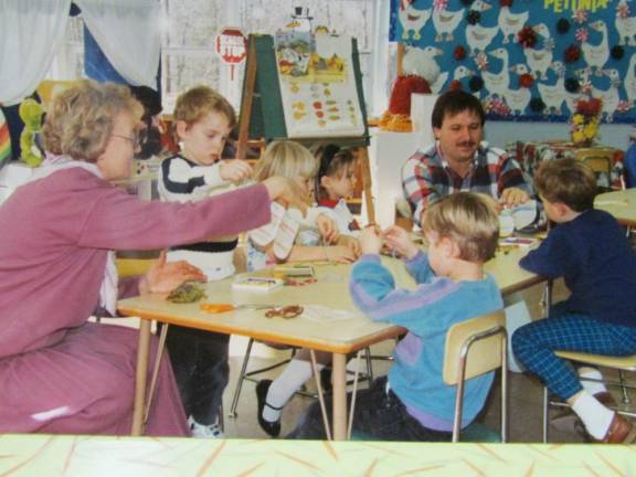 Kindergartners at Marshall Hill School in 1993 work on a creative project with the help of teachers Beth Schumm, left, and Terry Sandford.