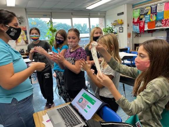 Junior girl scouts win automotive badge