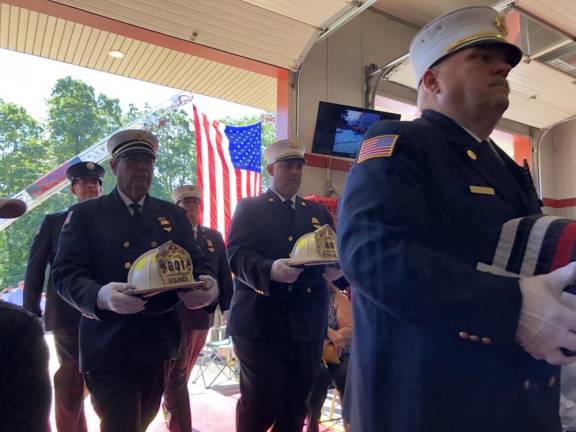 An honor guard escorts a box containing the ashes of Fire Commissioner Edward Steines into the West Milford Fire Company #4’s firehouse for a memorial service Sept. 2. (Photos by Kathy Shwiff)