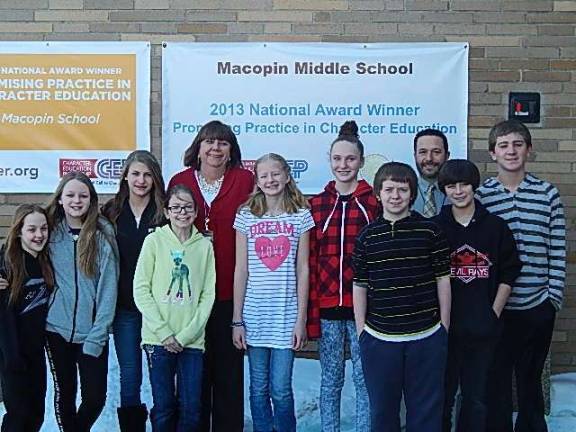 Pictured here are Mary Reinhold, Principal of Macopin Middle School, center, and Assistant Principal Marc Citro, right, along with some Macopin students.