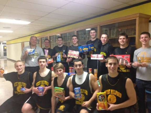 The West Milford High School Varsity Basketball team and Head Coach John Finke participated in Operation Thank You.