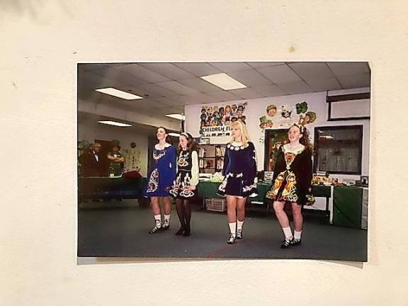 Westbrook School teacher Annie Darling (center) does step dancing with students in 2001. With her are Katy Dotson, Kathleen Best and Cassandra Corkhill.