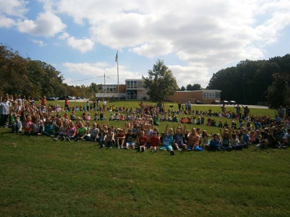 Students make pinwheels for whirled peace