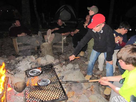Photos by Patricia Keller Making Jiffy Pop popcorn &amp; S'mores taste even better on a campfire the Cubs set up and started themselves (with adult supervision andguidance of course!).