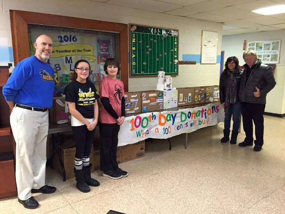 Pictured here are Liz and Ken Carroll from "Connect for Community," who sponsors the program, Maple Road School Principal Bill Kane, and two student representatives from the Maple Road School Student Council- sixth graders James Snyder and Abigail Weiss.