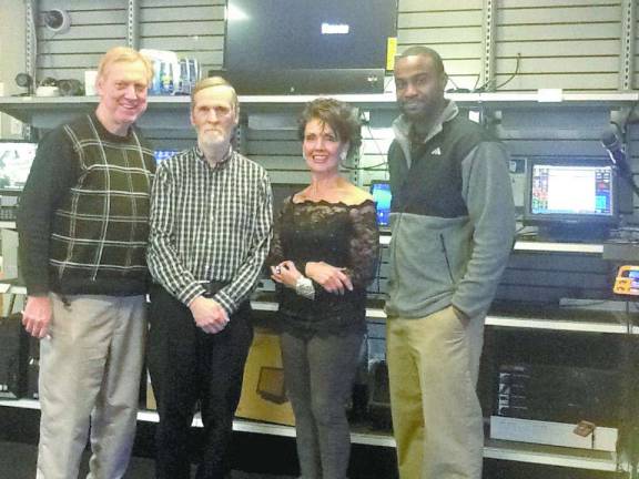 The staff at CDNJ, from left, Joe Russo, owner, Mike Andres, repair department manager, Julie Giampolo, executive assistant, and Taylor Jennings, on-site sales and service.
