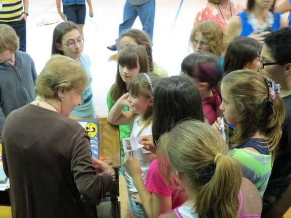 The students gathered around Marion Blumenthal Lazan after her talk to the fifth and sixth graders at PK.