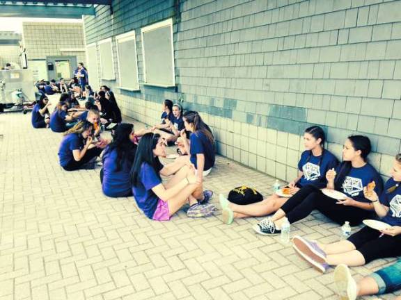 Diamond Cluster members ate their pizza at Sandy Hook.