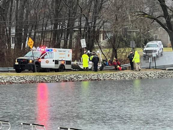 First-responders prepare to recover a vehicle that went into High Crest Lake in West Milford on Monday, Dec. 18. (Photo by Adam Apps)