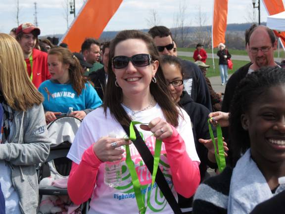 Lyndsay Wright of West Milford receives her metal after crossing the finish line of the MS Walk last month. Wright was diagnosed when she was just 17.