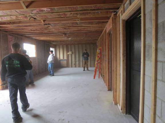 Building trades students help demolish firehouse