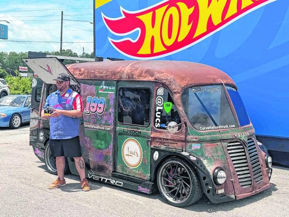 L.J. Koch stands in front of the Luca food truck.