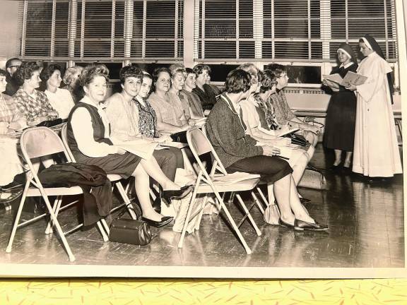Nuns at Our Lady Queen of Peace Church in Hewitt address parish women at a meeting in the parochial school in the 1960s. (File photo by Ann Genader)