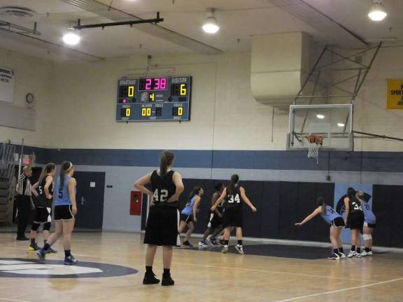 West Milford's Anneke Green (34) scores from the foul line late in the fourth period.