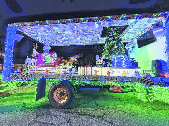 A truck decked out in Christmas lights.
