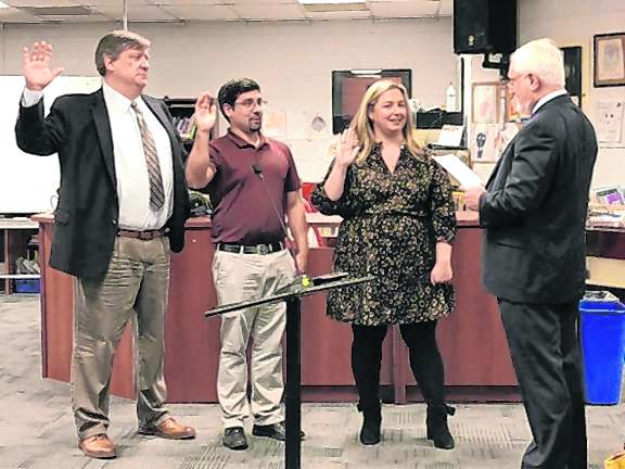 From left, Peter Lippe, William Cytowicz and Tara Racano are sworn in to three-year terms on the West Milford Board of Education by board attorney Andrew Brown at the reorganization meeting Jan. 3, 2023. (File photo by Kathy Shwiff)