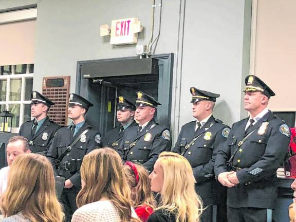 Police Chief Shannon Sommerville, right, stands with other officers at the Township Council meeting Jan. 3. (Photo by Kathy Shwiff)