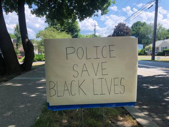 One of many signs that have popped up around town in recent weeks, pitting supporters of law enforcement against supporters of the Black Lives Matter movement.