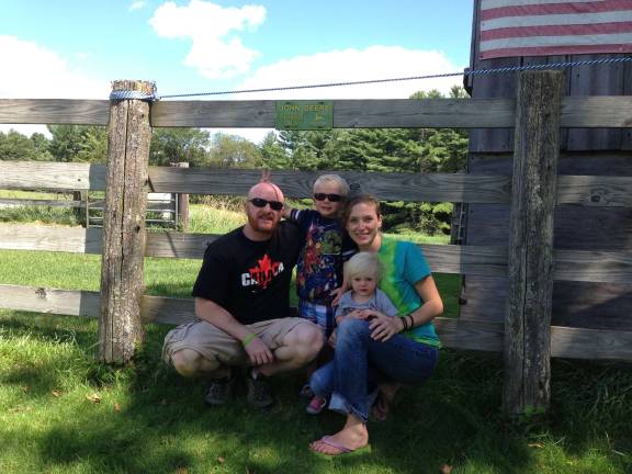The Newton family - Scott, Aaron, Kerrie and Ashlyn - see happier days ahead as they spread the word about childhood cancers.