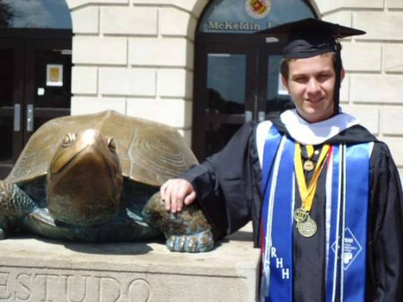 Mike Lichtenberg of West Milford is seen here with a statue of a terrapin, the mascot of the University of Maryland, on his graduation day.