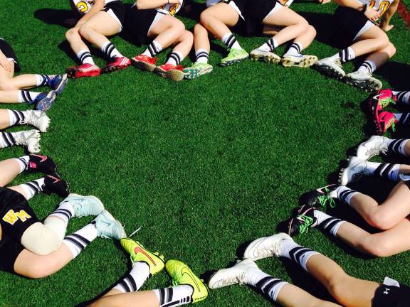 The girls have fun on and off the field.