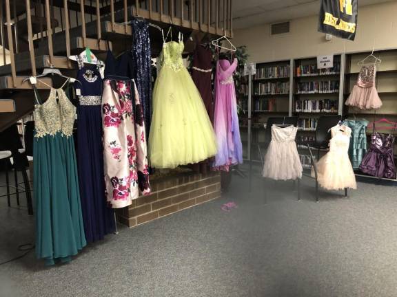 Dresses are displayed in the high school’s lower media center.
