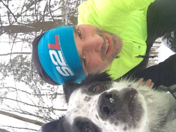 Muniz and his dog Tasha take a selfie after one of their trail runs.