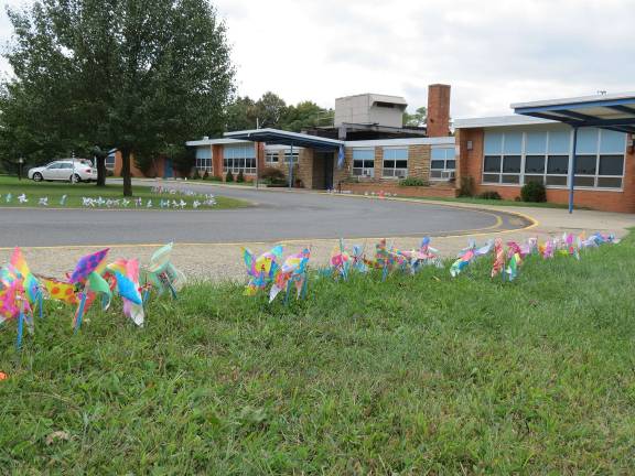 Students make pinwheels for whirled peace
