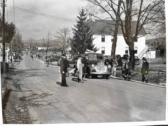 The West Milford Village building at 1468 Union Valley Road, built in 1930 to serve as Mechanics Hall, later became the first firehouse of West Milford Fire Company No. 1. The officer in this 1940s photo is John F. Moeller, father of John H. Moeller, who became the police chief. (Photo provided)