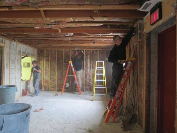 Building trades students help demolish firehouse