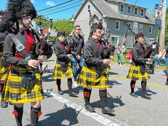 Members of the West Milford Highlander Band Pipes &amp; Drums march in the Memorial Day parade. (Photo by Denise von Wilke)