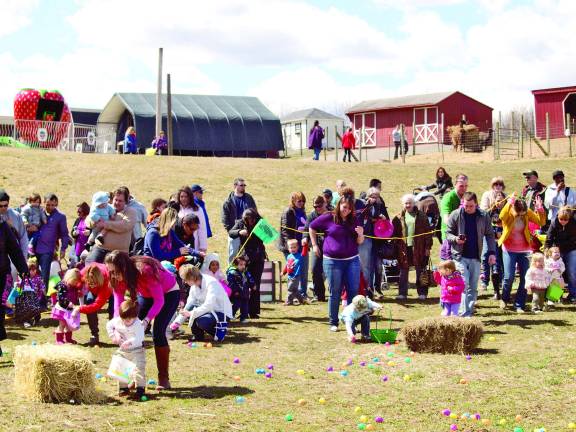 Children scurry to find some easter treats.