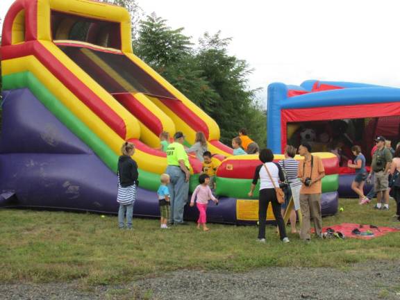 Children enjoy the inflatable slide at a previous Autumn Lights Festival