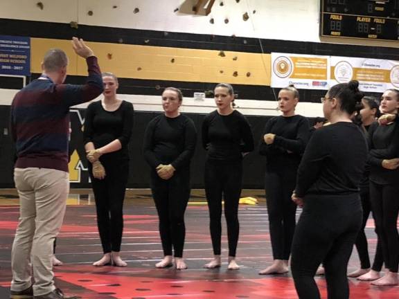 A judge comments on the West Milford Color Guard’s program. (Photo by Kathy Shwiff)