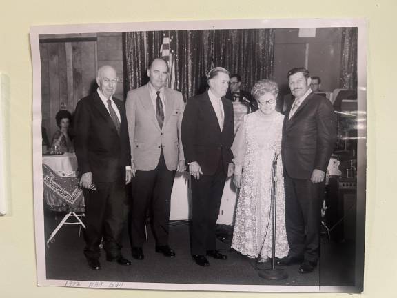 Pine Village Grove, a former Oak Ridge restaurant, is the scene of the 1972 West Milford Police Benevolent Association (PBA) Ball. The building is now the location for Freedom church. From left are Police Chief John Moeller, Mayor George Eckert, West Milford Police Commissioner Walter Dearcopp, Township Committeewoman Mollie McFarland and Police Captain James Semento. Photo by Ann Genader