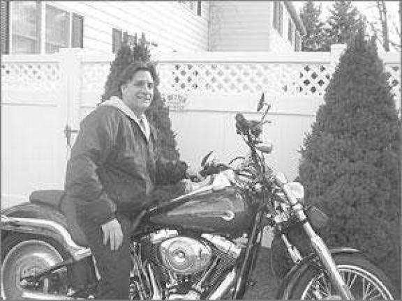 Hewitt priest follows his own path to God on a Harley