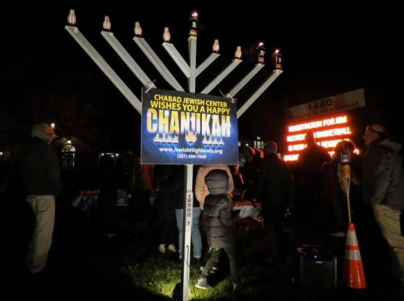 The following photographs by Patricia Keller capture just some of the moments at the annual menorah lighting at West Milford Town Hall earlier this week.