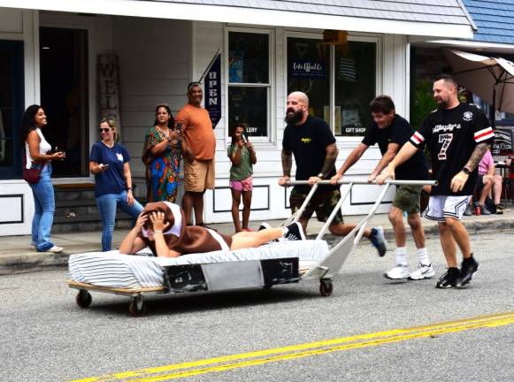 Pushing the Murphy’s Tavern &amp; Restaurant bed carrying Della Martin are, from left, Steve Marino, Ralph Costanza and Bryan Martin. Murphy’s came in second this year after winning the race in 2013 and 2014, the last time it was held. (Photos by Fred Ashplant)