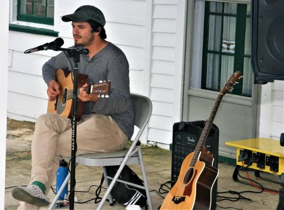 [Musician Casey Ferriola performs at the Wallisch Homestead Music Festival on Saturday. Charles Kim photo]