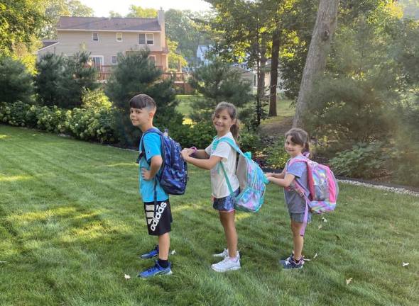 Daniel, Ilona and Evelyn line up on their first day of fifth, third and first grade, respectively.