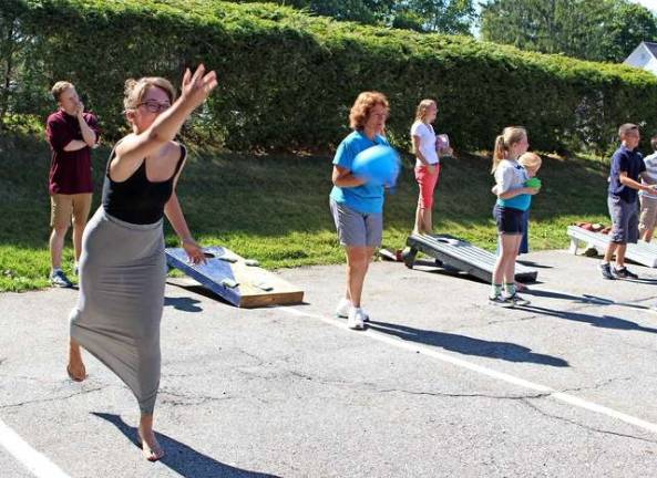 Who says games are just for kids? A game of water balloon toss was fun for all ages.