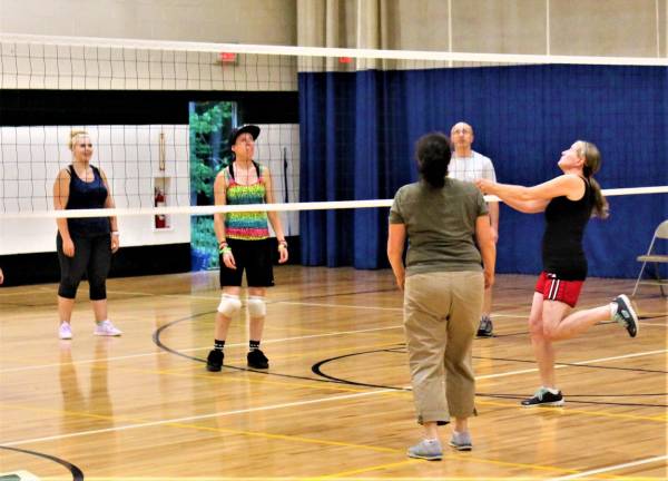 Co-ed volleyball players learn the basics of the game Wednesday night at the Rec Center.
