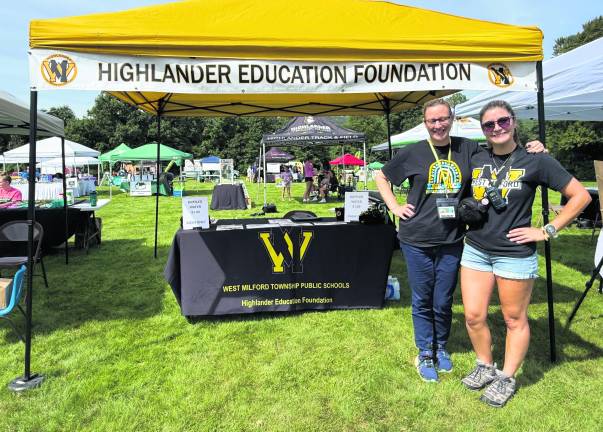 Lisa Johnson, volunteer, and Marisa Gough pose for a photo.