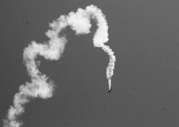 Dennis Thompson of Mays Landing shows everyone what he can do with his aircraft as smoke follows his every move.