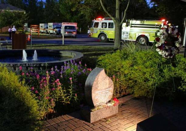 West Milford's teardrop 9/11 monument and memorial wreath, with its emergency vehicles lining the driveway at the town hall after the 9/11 ceremony last Thursday.