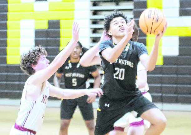 West Milford's Josh Moreno (20) leaps during a shot. Moreno scored 16 points.